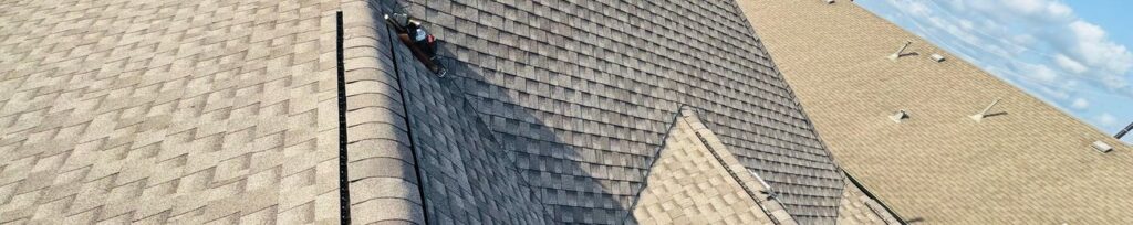 Aerial view of a completed dark architectural shingle roof on a Texas home