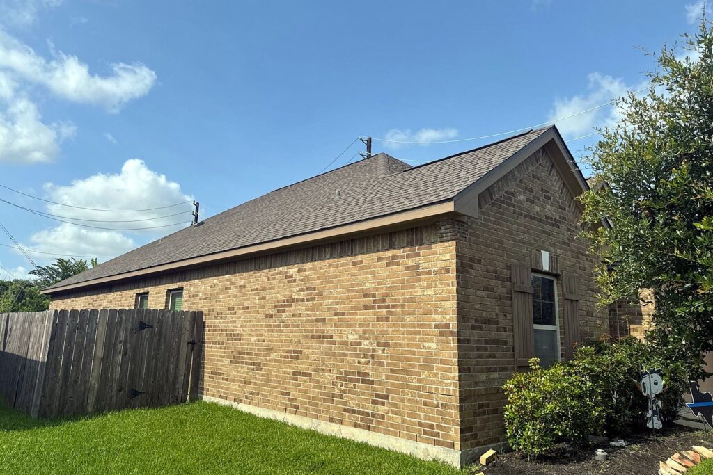 Single-story brick home in Pearland after its hail roof replacement