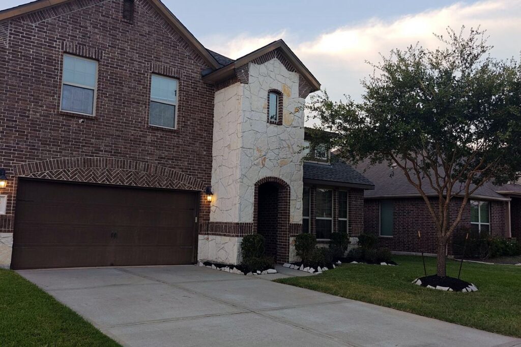 Two-story Pearland home after a hail roof replacement with solar reset