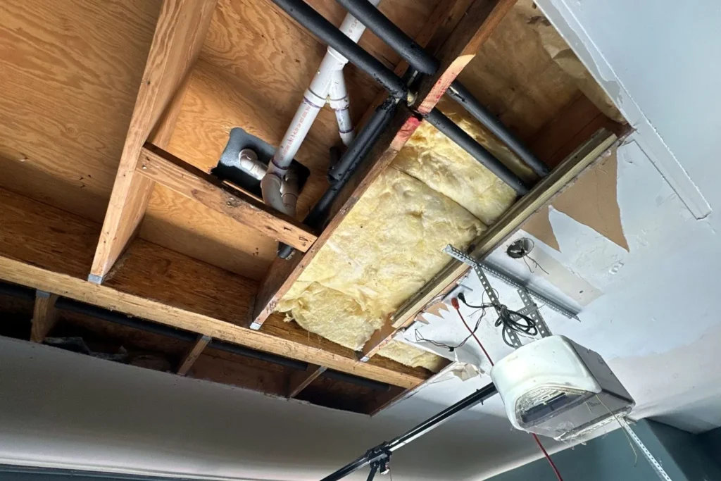 Garage ceiling opened up for water damage repair in Cypress, TX