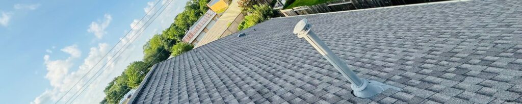 Close-up of newly installed architectural asphalt shingles on a Texas roof