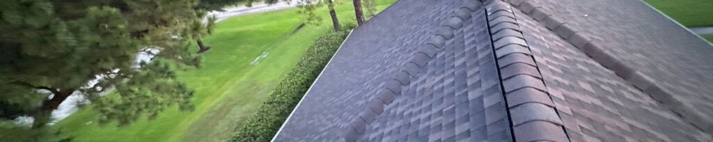 View along a finished roof ridge overlooking a Houston-area neighborhood